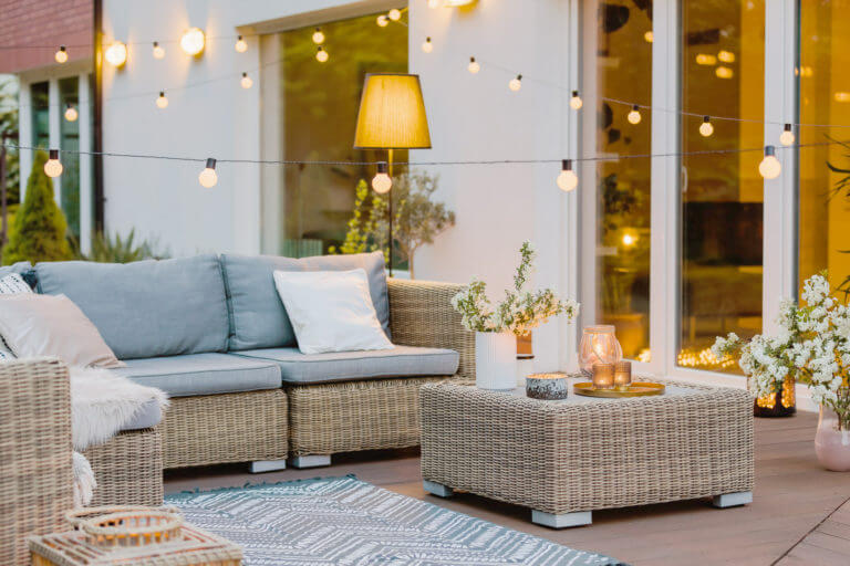summer-with-patio-with-wicker-furniture-and-lights-TK9D24F